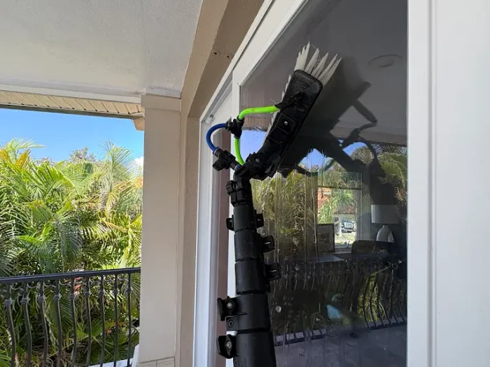 Water-fed brush head detailing a sliding glass door in Tampa