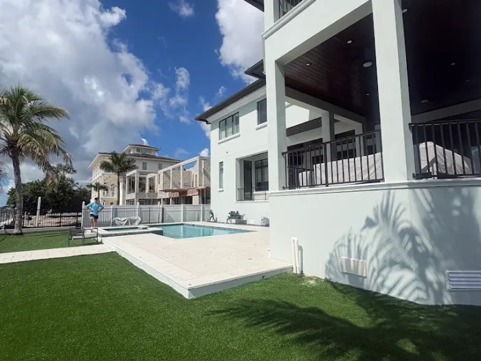 Rear elevation and pool of a waterfront Tampa estate serviced by Pelican Exteriors