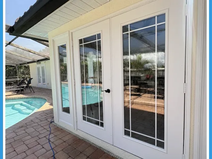 Freshly cleaned french doors onto a screened pool lanai in Tampa