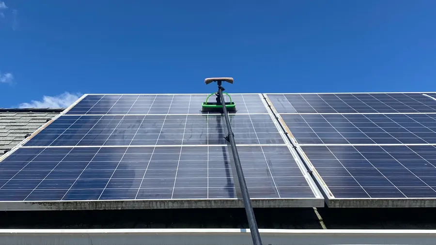Water-fed pole cleaning a solar panel array